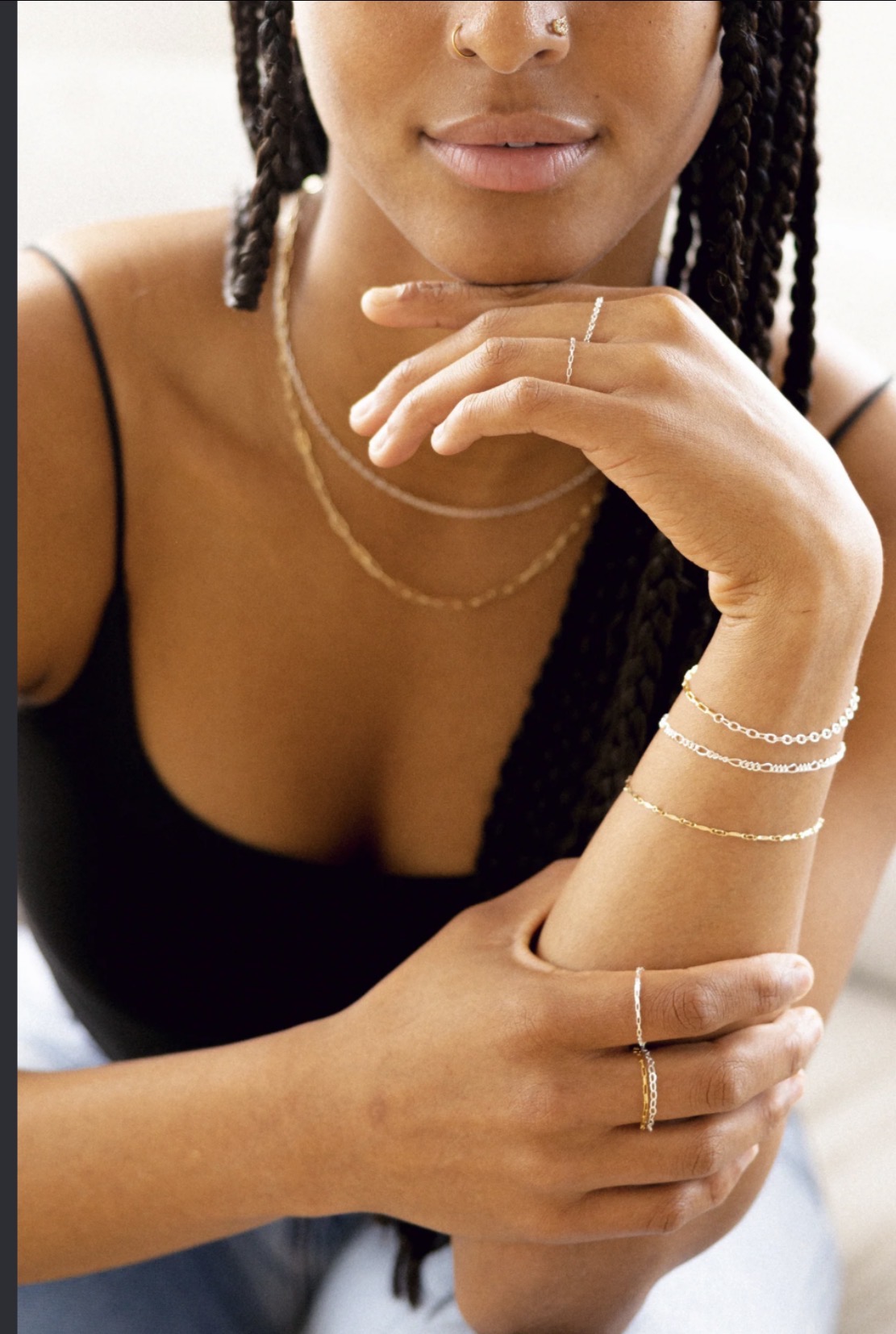 Layered permanent gold necklaces, bracelets, and rings